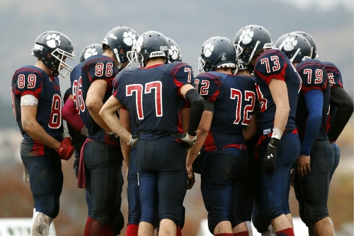 Write a statement about teamwork can draw inspiration from sports like football.