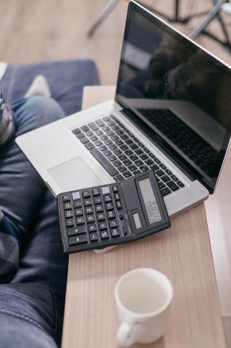 prospective grad student considering is GMAT vs GRE options while sitting in front of computer