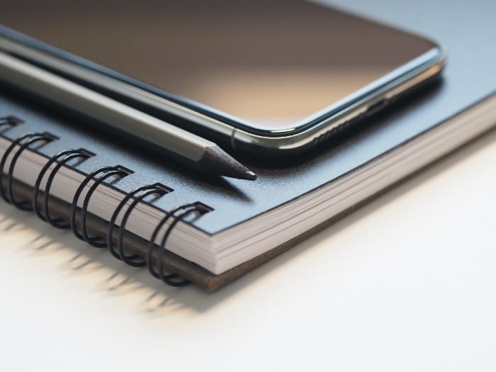 While exploring various graduate business degrees can be hard to decipher, a phone, a notebook, and a pen are useful in both