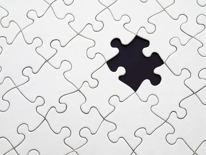 A single puzzle piece missing, symbolizing the importance of finding the right fit in a PhD program