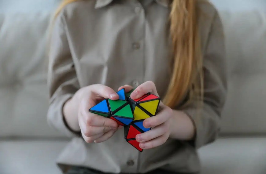 PhD applicant thinking of questions to ask while playing with puzzle