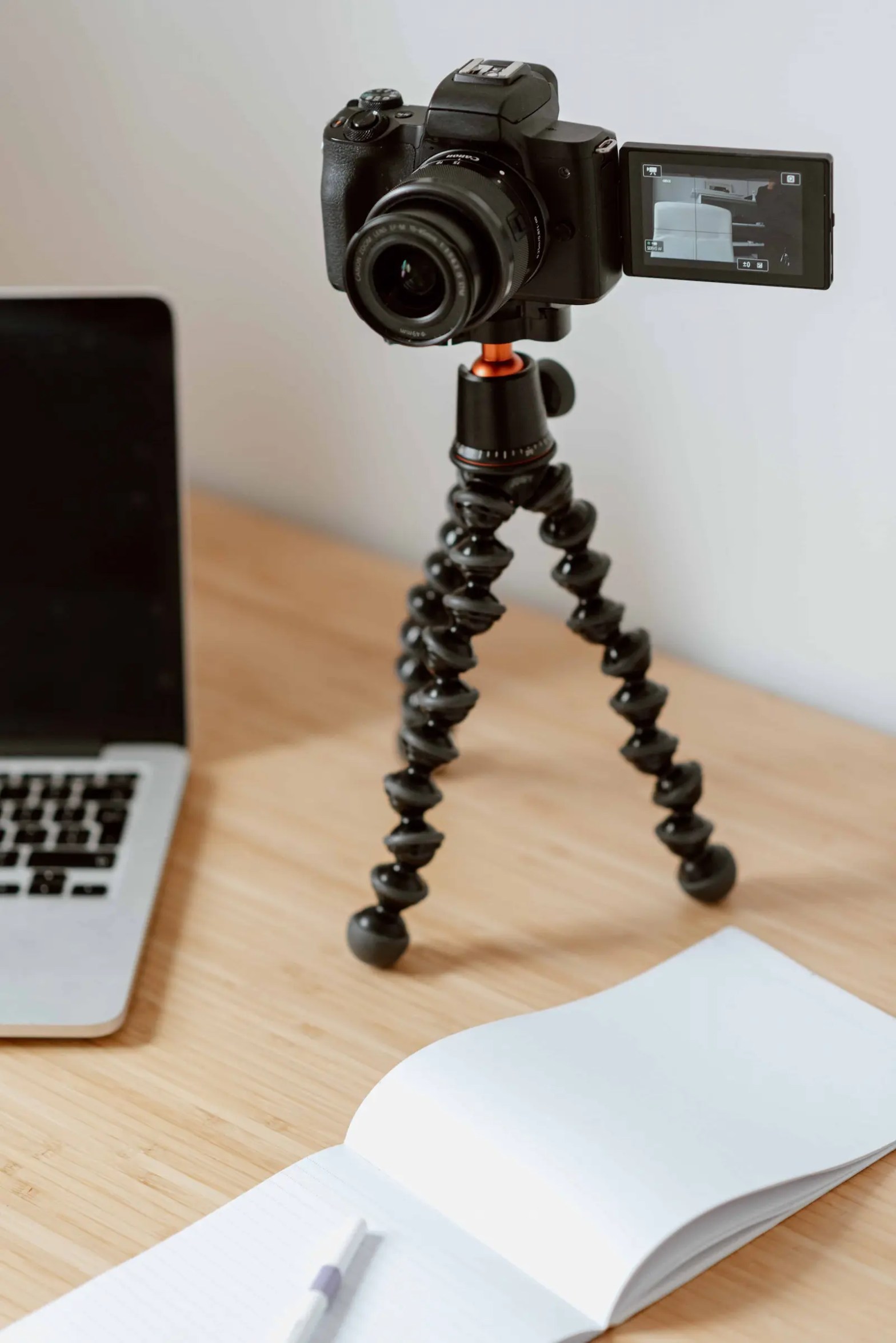 A camera, notes, and a computer are good tools to have if you want to ace your MBA video essay