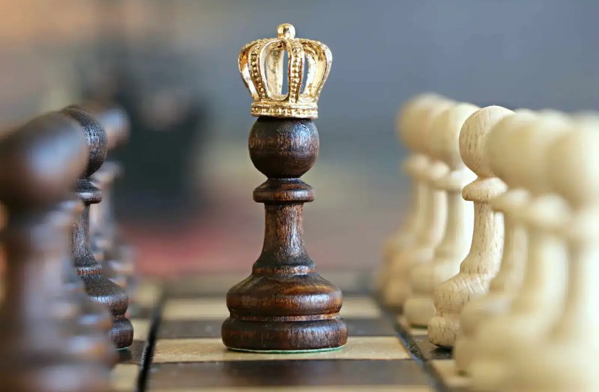 Chess pawn with a crown symbolizing strategy and transformation — representing how a strong statement of purpose for scholarship applications helps you stand out