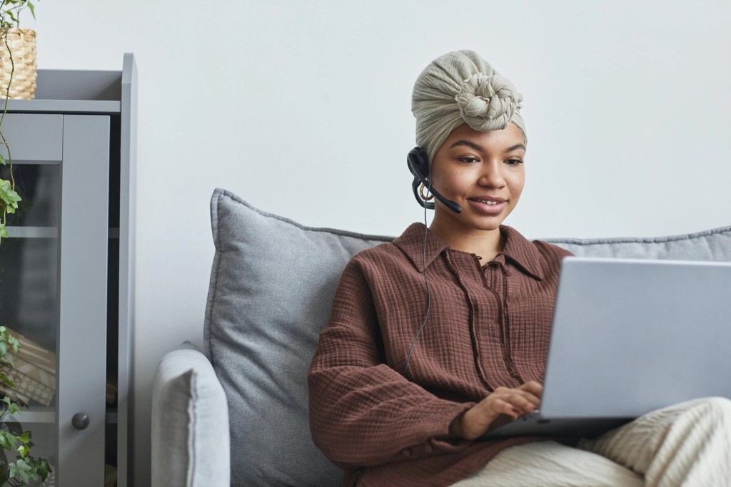 girl on couch on laptop