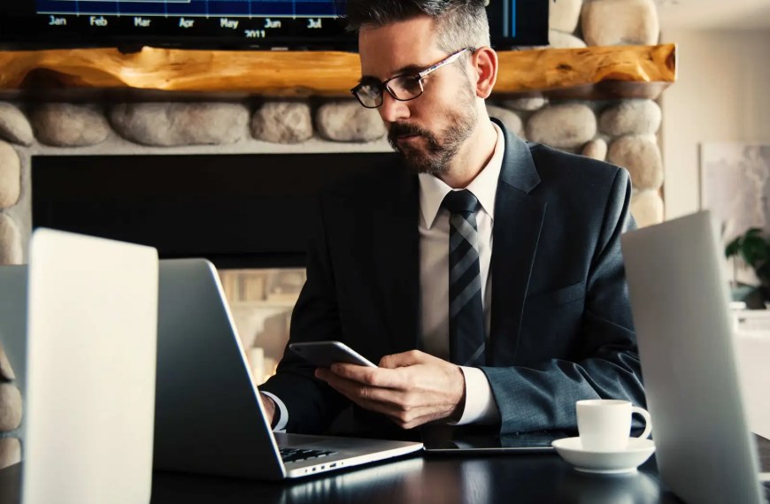 man reading executive MBA essay examples
