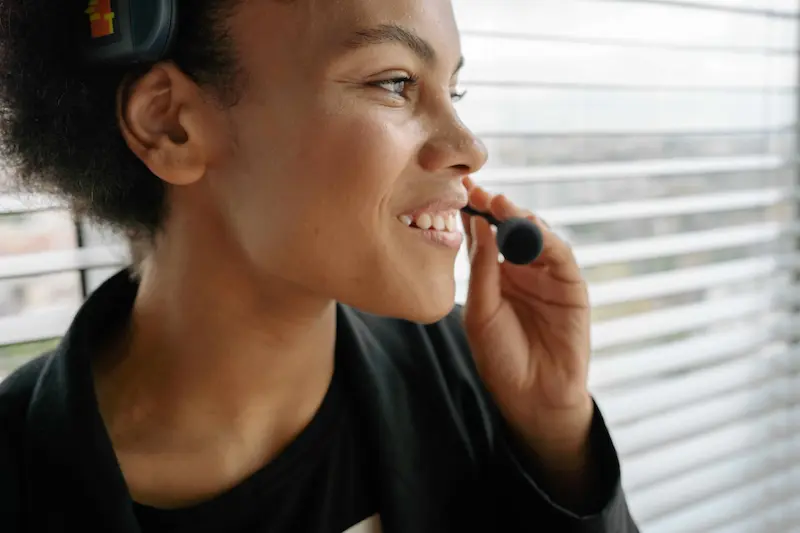 phd student with headset talking and smiling