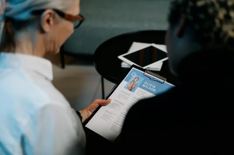 two mba officers looking at an applicant's resume