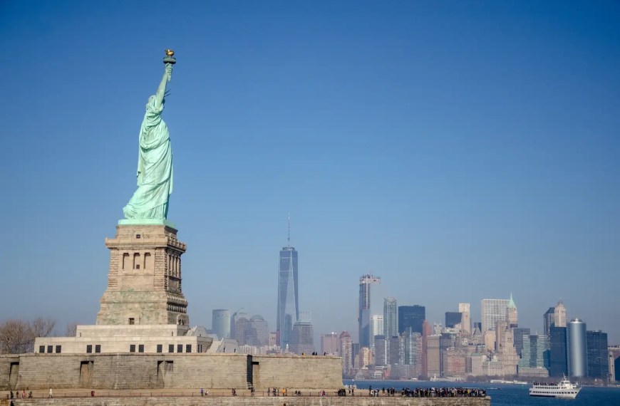 Statue of Liberty in front of the New York City skyline on a clear day, symbolizing opportunity and freedom for international students