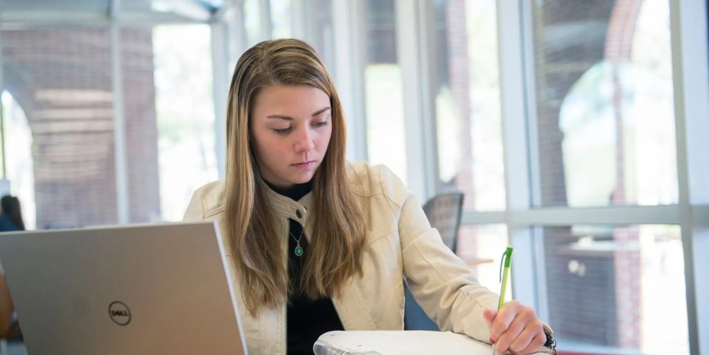 writer working at desk — MFA program sample work environment