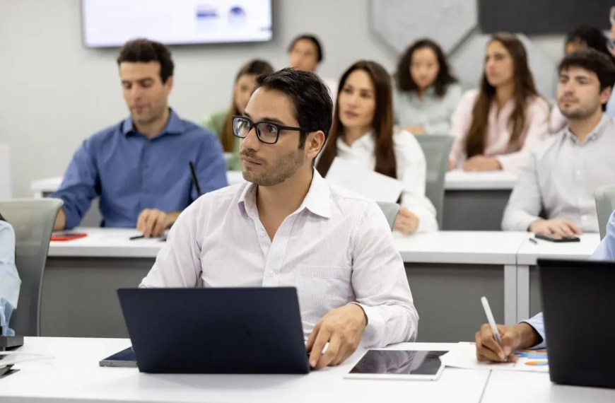 Experienced executives learning in a top executive MBA program classroom