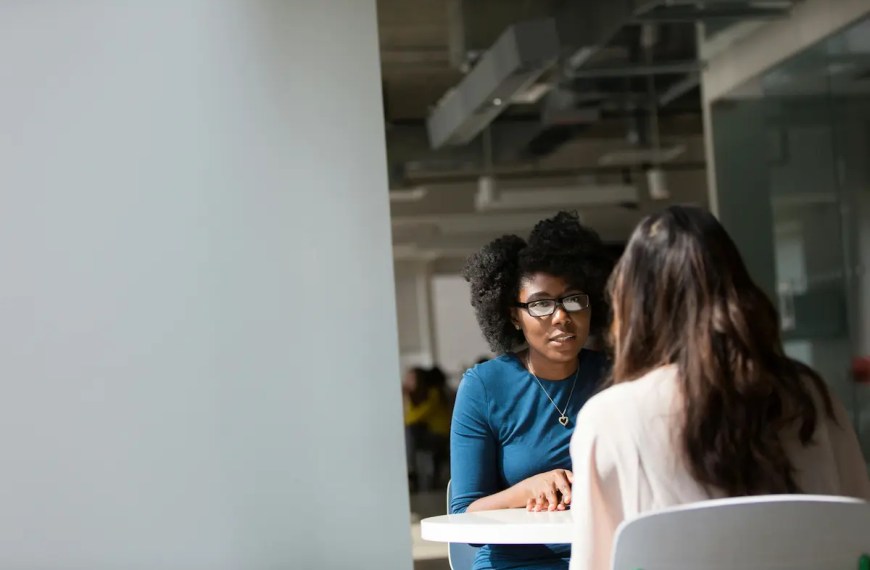 PhD candidate in academic interview conversation with professor reflecting the process of PhD interview rejection and evaluation