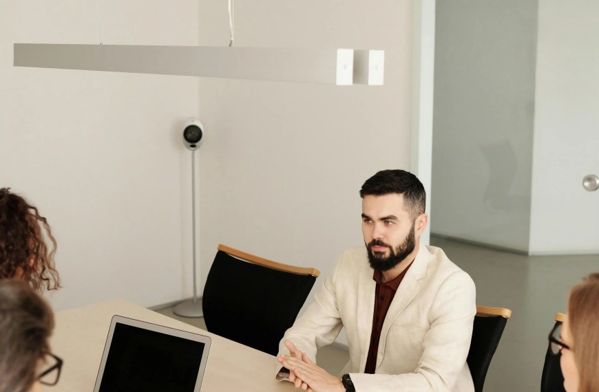 PhD applicant speaking with faculty committee during an academic interview evaluating research direction and supervision fit