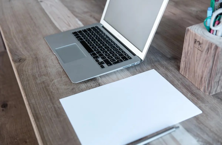 Statement of purpose reviewed with writing materials on a desk for graduate admissions evaluation chatbot query reddit