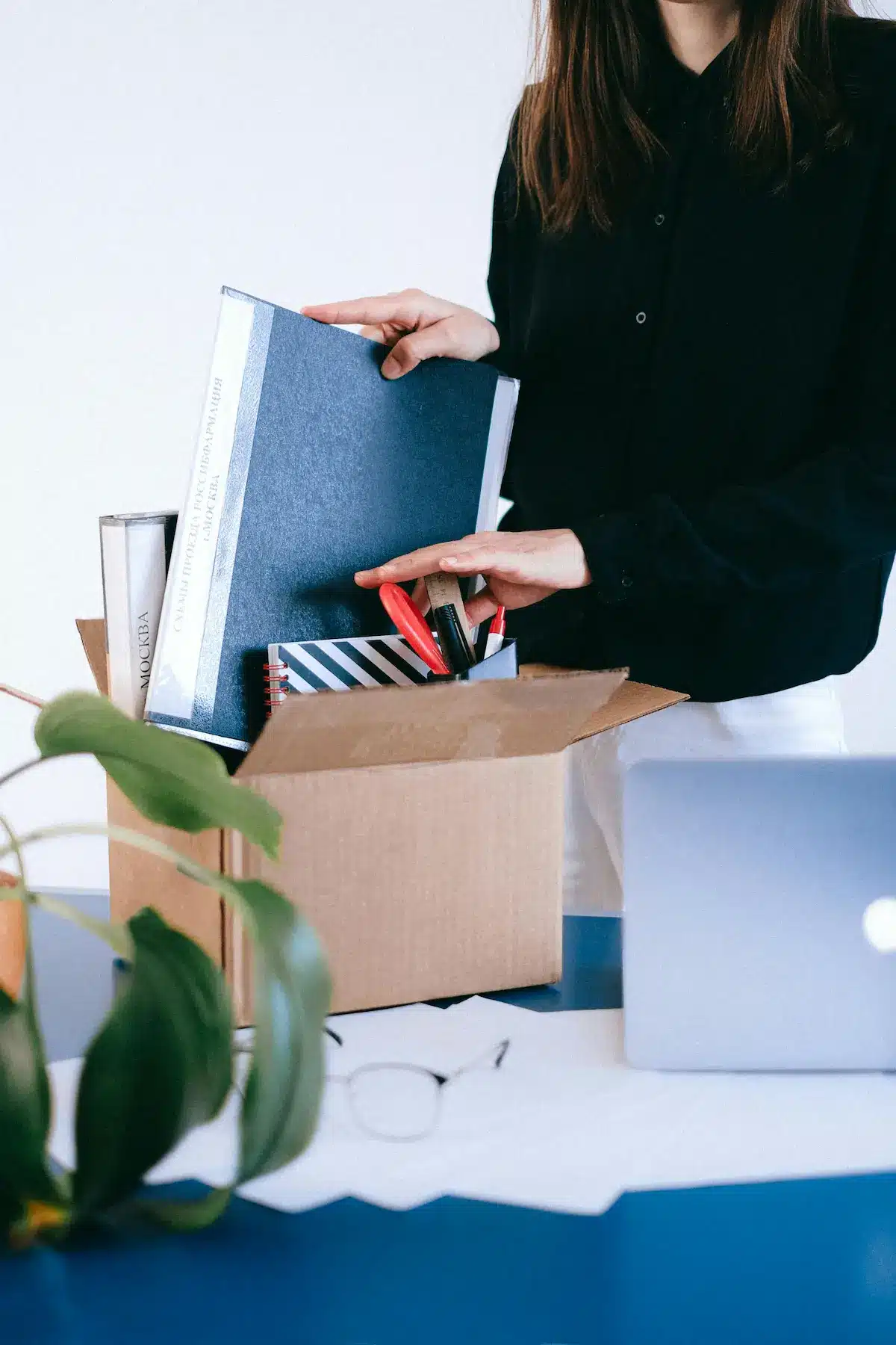 Professional preparing for a career change at 40 with graduate school materials on a desk
