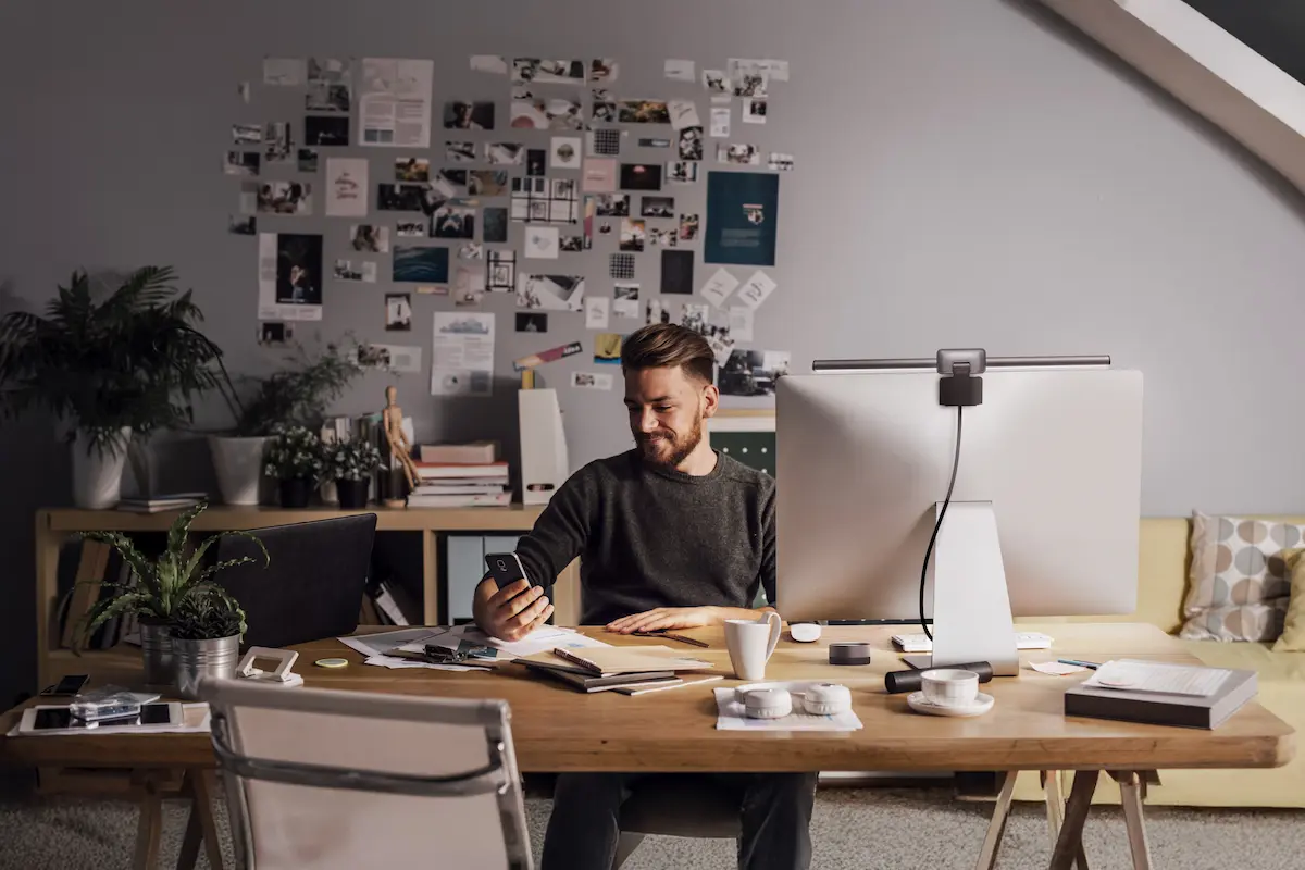 Professional in their early forties reviewing research materials and planning a PhD application